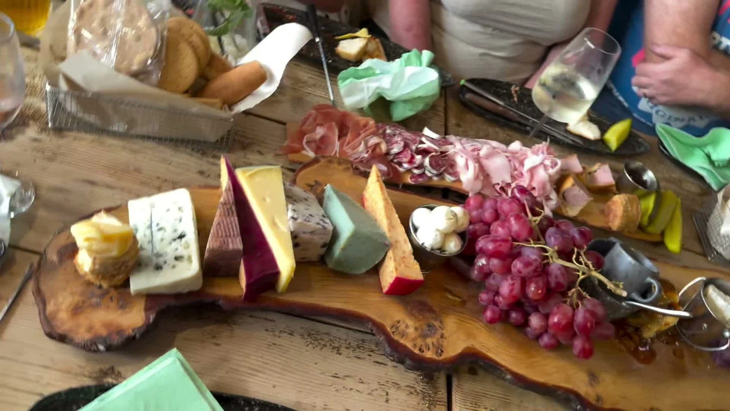 Artisan cheeses on a Tipsy Cows board