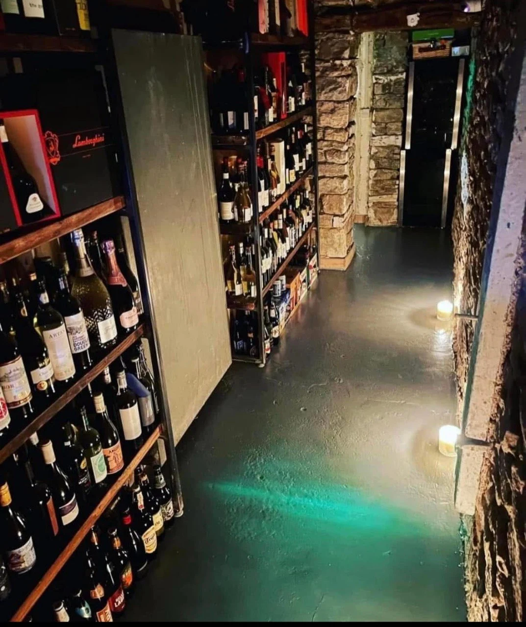 The steps and wine-lined passage into the cellar