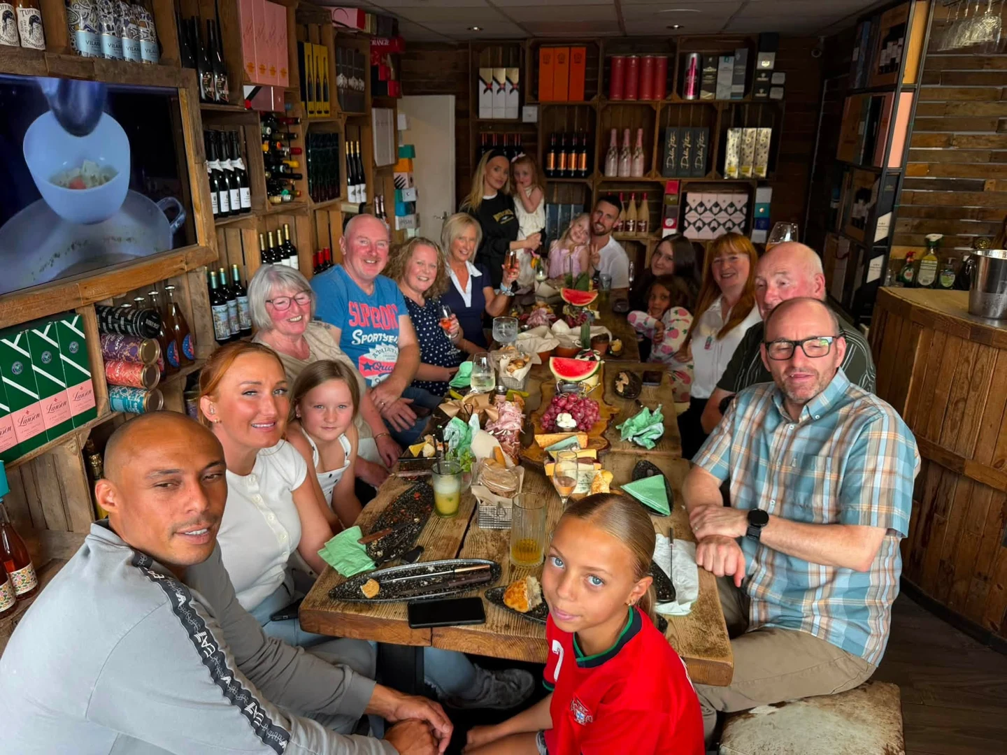 Friends sharing cheese and drinks at Tipsy Cows in August 2026