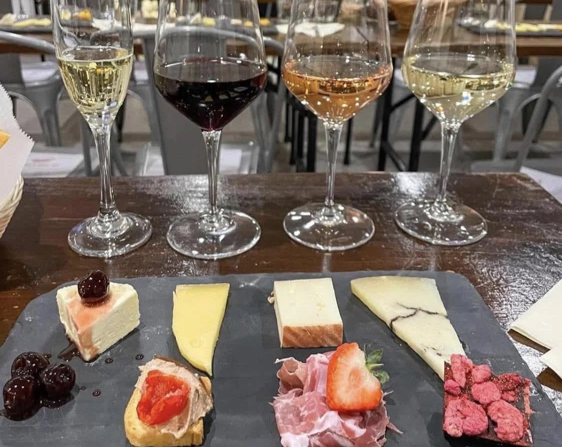 Four wines with a cheese pairing board