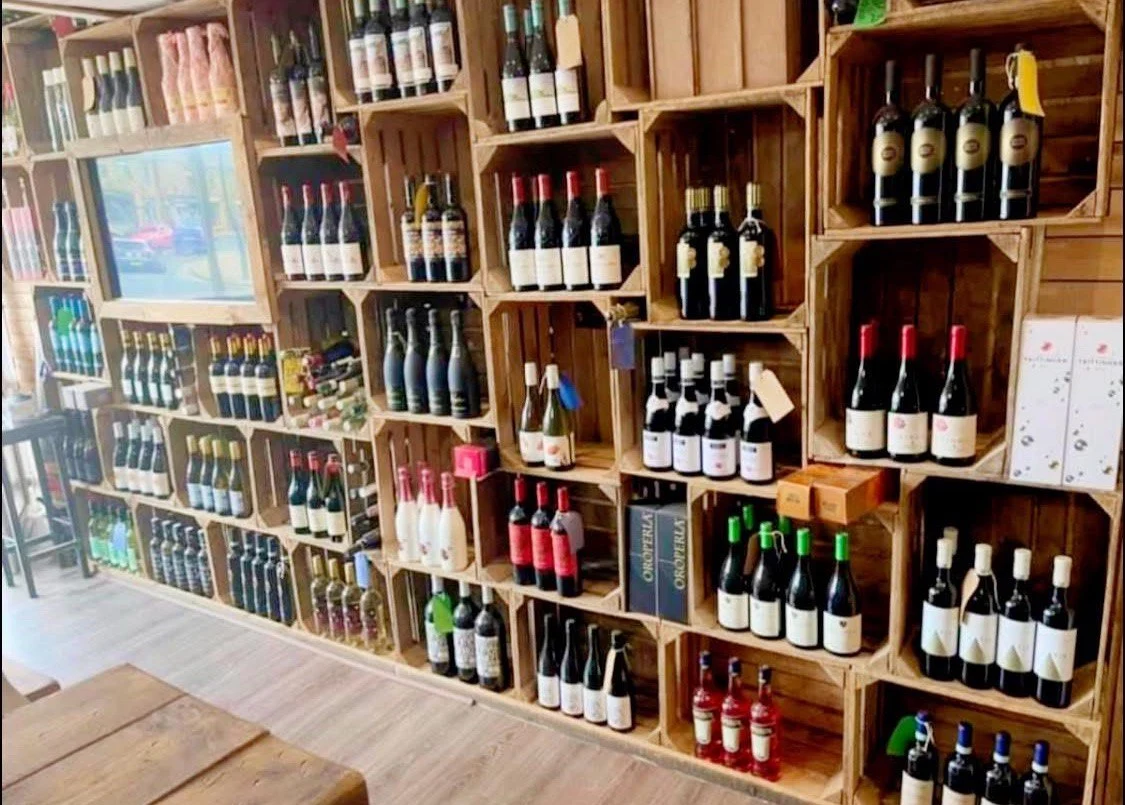 Shelves filled with wine and spirits inside Tipsy Cows